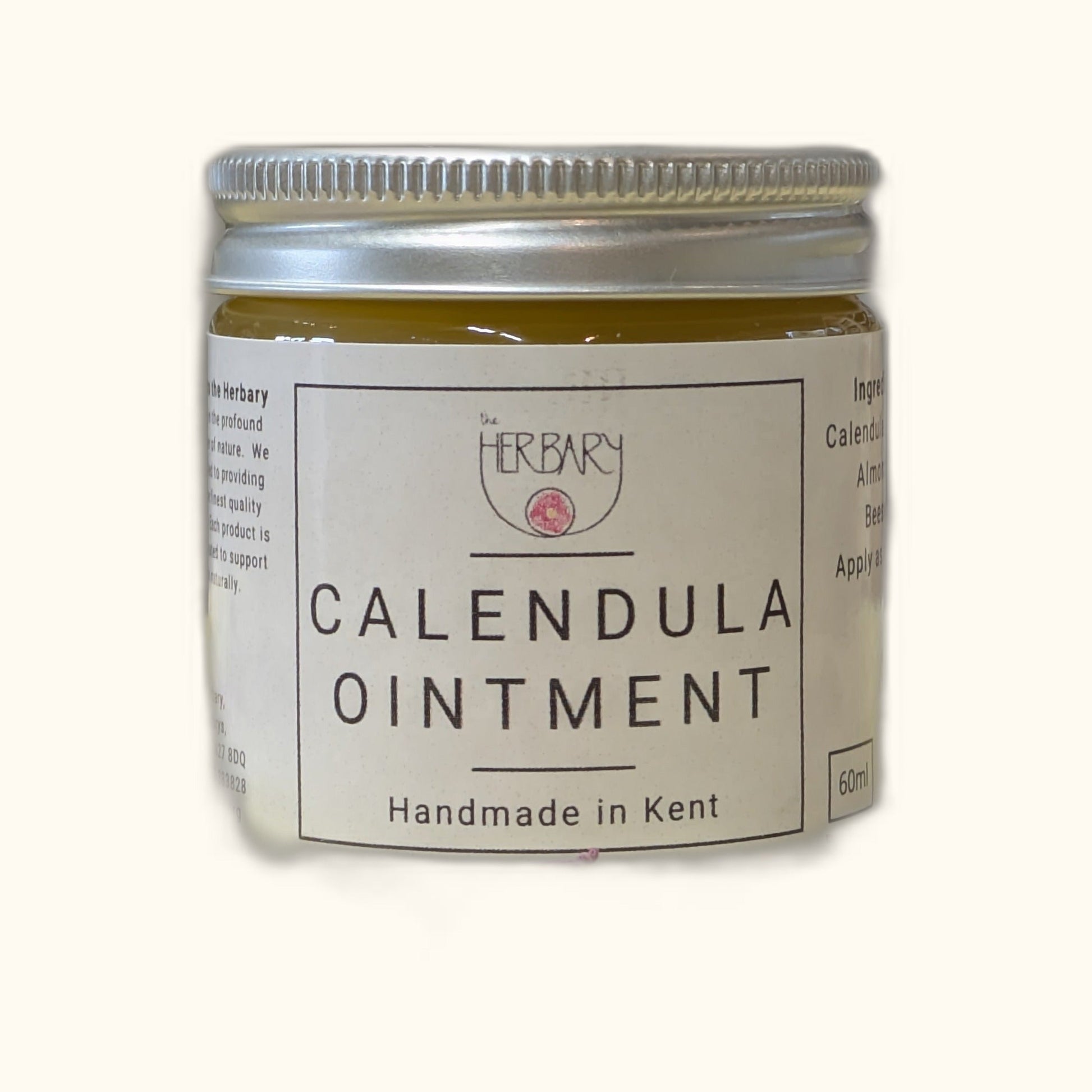 Calendula Ointment on clear cream background