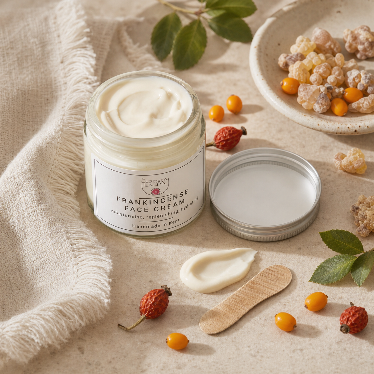 Frankincense Face Cream texture and botanical routine still life