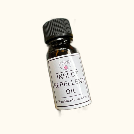Insect Repellant Oil on clear cream background