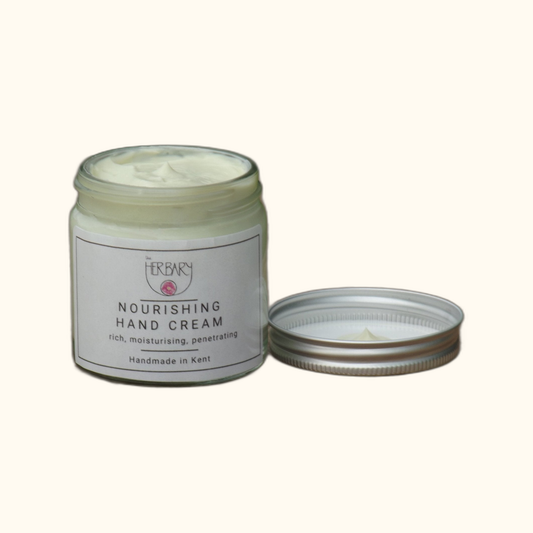 Nourish Hand Cream on clear cream background