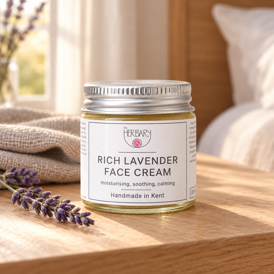 Rich Lavender Face Cream beside lavender on a bedside table — The Herbary