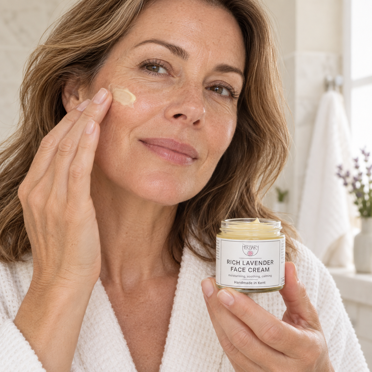 Rich Lavender Face Cream being applied to the cheek — The Herbary