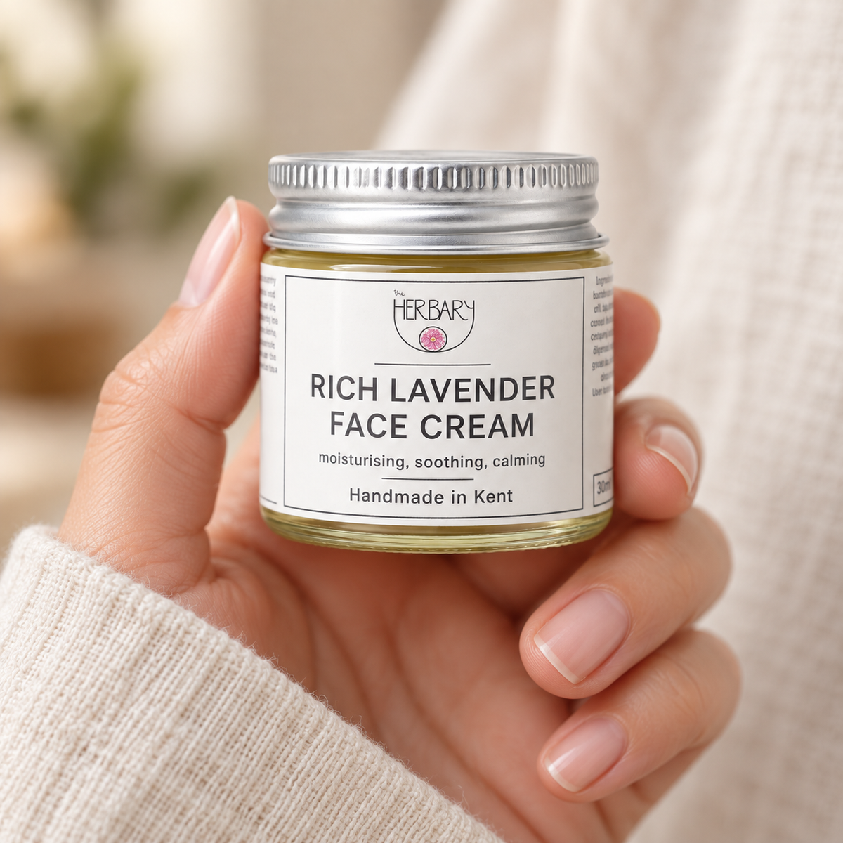 Rich Lavender Face Cream 30ml jar held in one hand — The Herbary