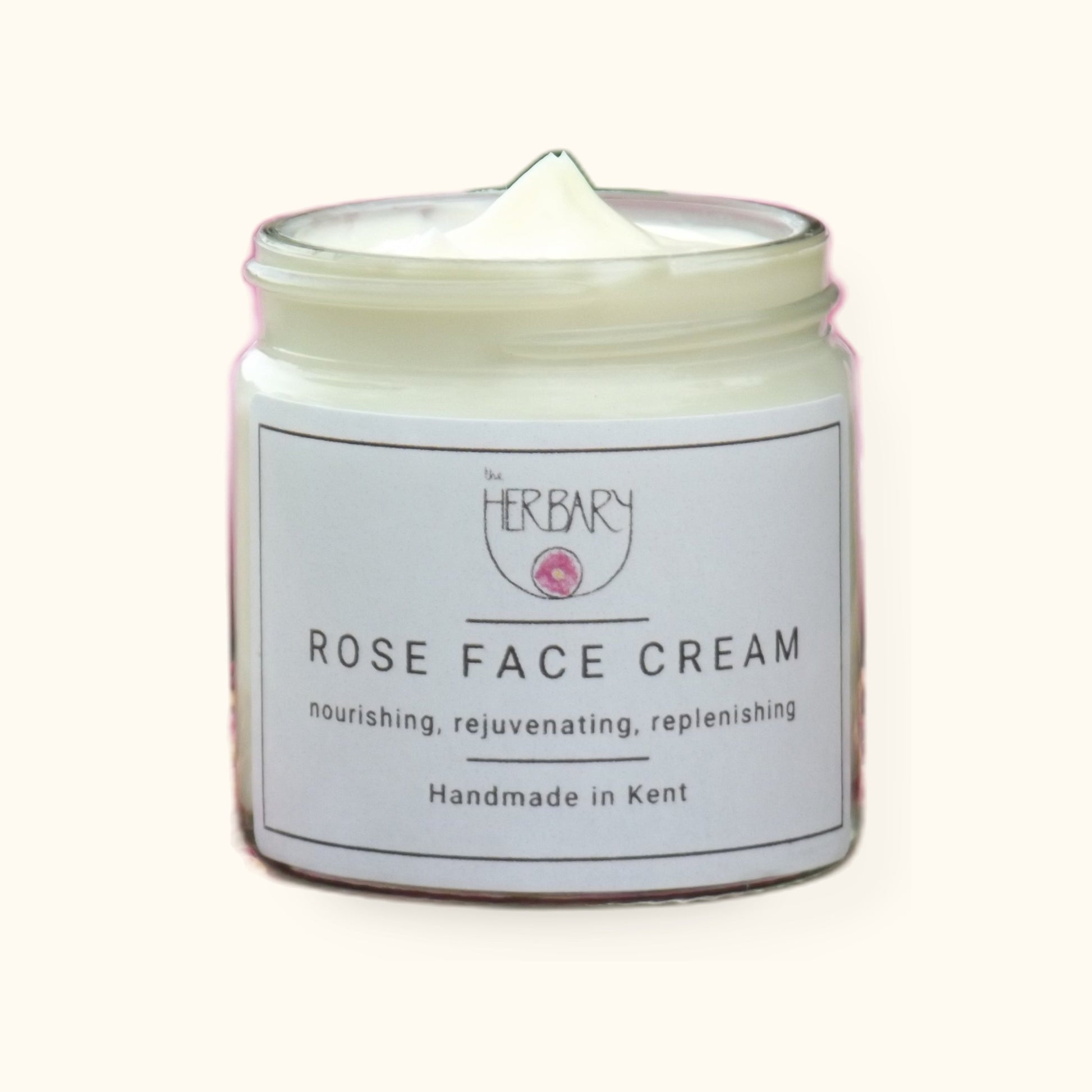 Rose Face Cream on cream background with shadow