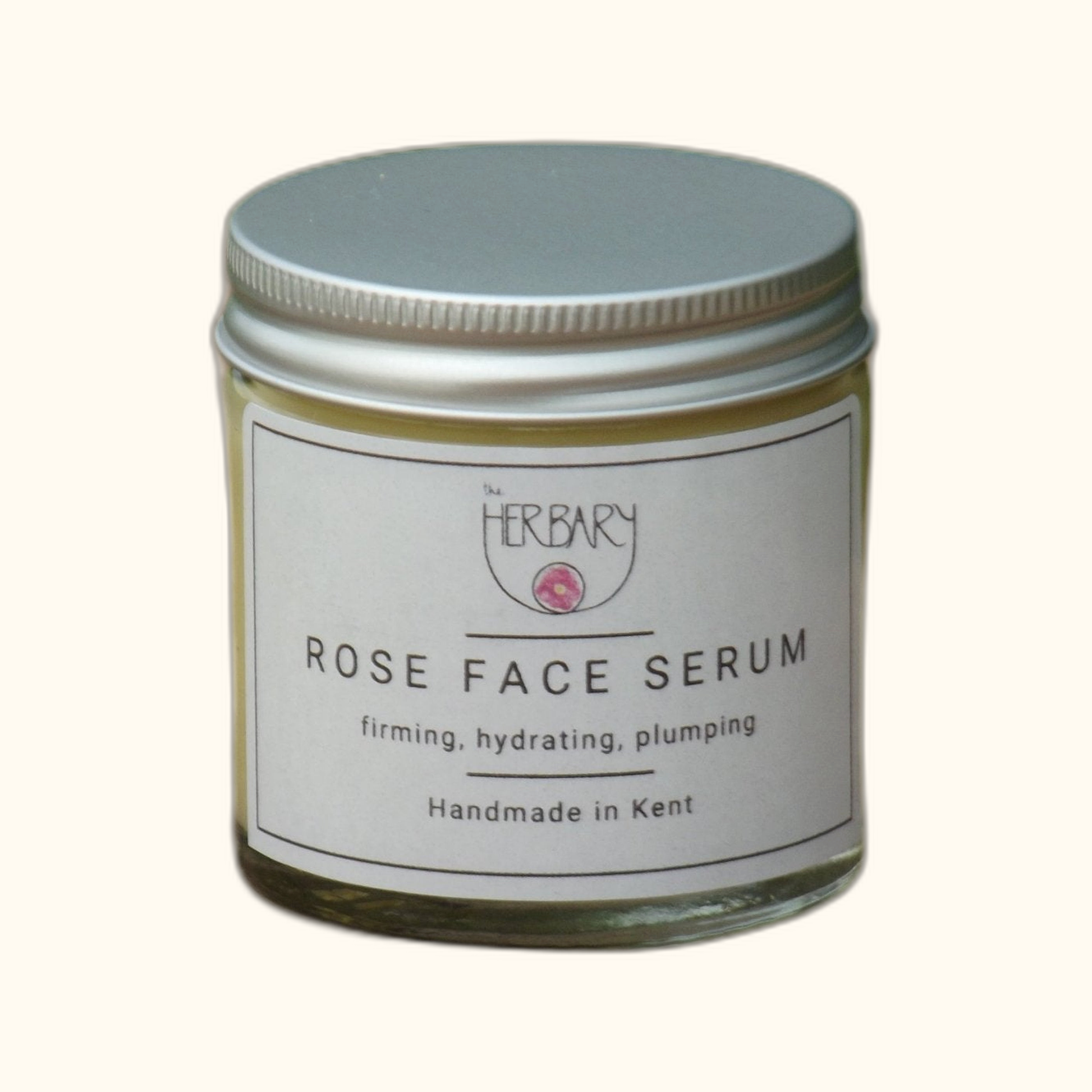 Rose Face Serum on clear cream background
