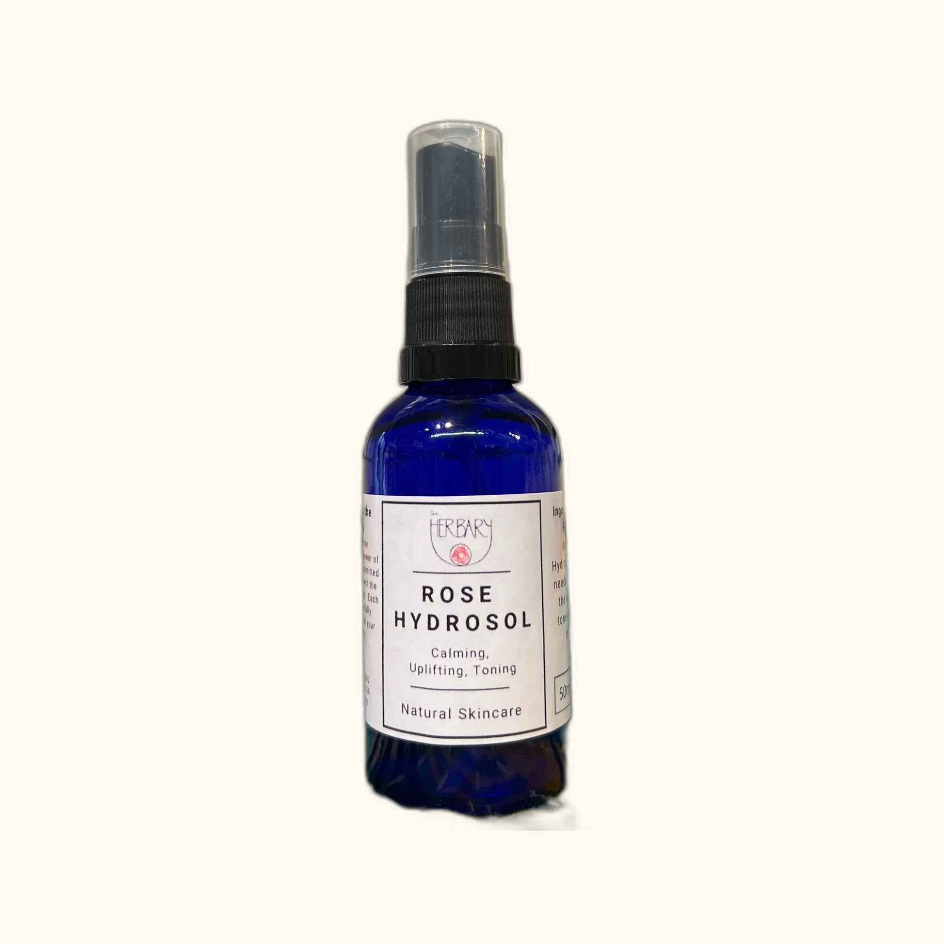 Rose Hydrosol on clear cream background