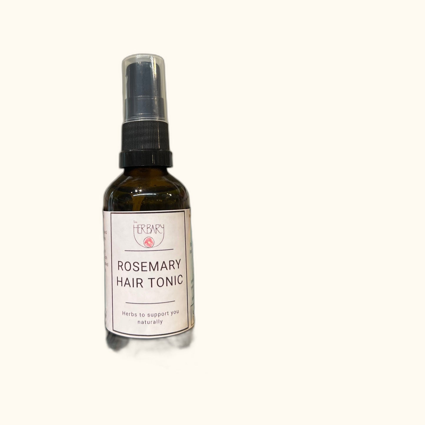 Rosemary Hair Tonic on clear cream background